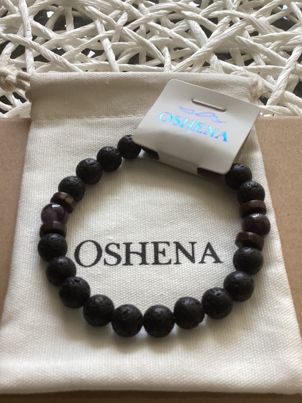 Oshena Black Lava Bead Stretch Bracelet with Amethyst beads.